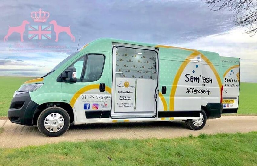 Sam's Woof Wash branded mobile dog grooming van parked on a Bristol street